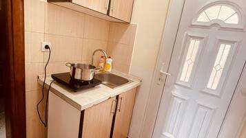 Mini-fridge, stovetop, coffee/tea maker, electric kettle