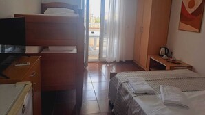 A hotel room with a bed, a TV, a wardrobe, and a balcony with curtains. - Mahara Doo (Bar)