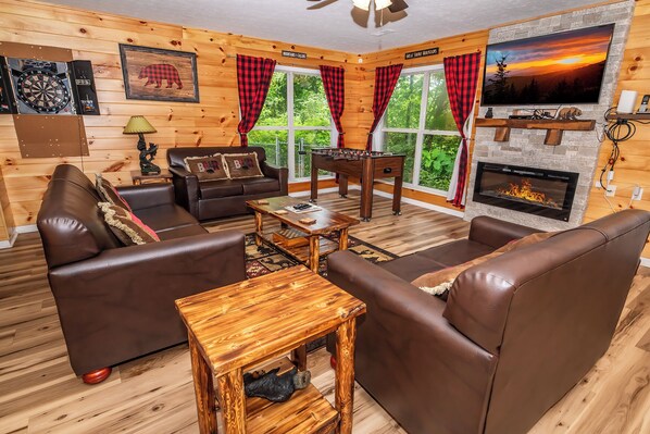 TV, fireplace, table football - *Cozy 2BD Cabin w/ HOT TUB! Fire Pit + Theater* (Sevierville)