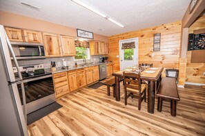 Fridge, microwave, oven, stovetop - *Cozy 2BD Cabin w/ HOT TUB! Fire Pit + Theater* (Sevierville)