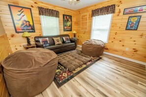 TV, fireplace, table football - *Cozy 2BD Cabin w/ HOT TUB! Fire Pit + Theater* (Sevierville)