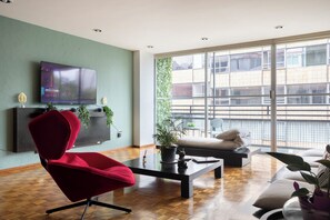 Luxury Apartment, 3 Bedrooms, Refrigerator | Living area | 60-inch Smart TV with cable channels, Netflix, streaming services