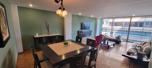 Luxury Apartment, 3 Bedrooms, Refrigerator | Living area | 60-inch Smart TV with cable channels, Netflix, streaming services