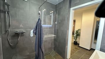 Shower, hair dryer, towels, toilet paper