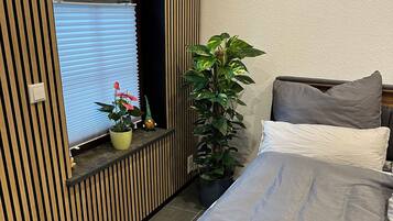 1 habitación, caja de seguridad en la habitación y ropa de cama