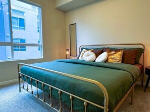 1 bedroom, desk, iron/ironing board, travel crib