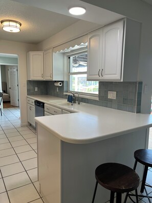 Fridge, microwave, oven, stovetop - Private home with Heated Pool and Boat Dock (Cocoa Beach)