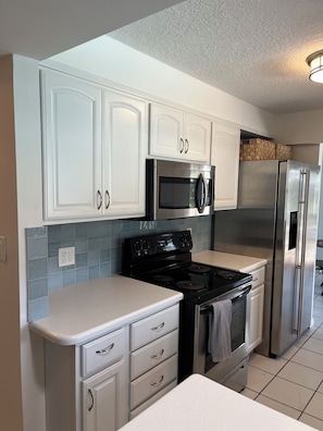 Fridge, microwave, oven, stovetop - Private home with Heated Pool and Boat Dock (Cocoa Beach)