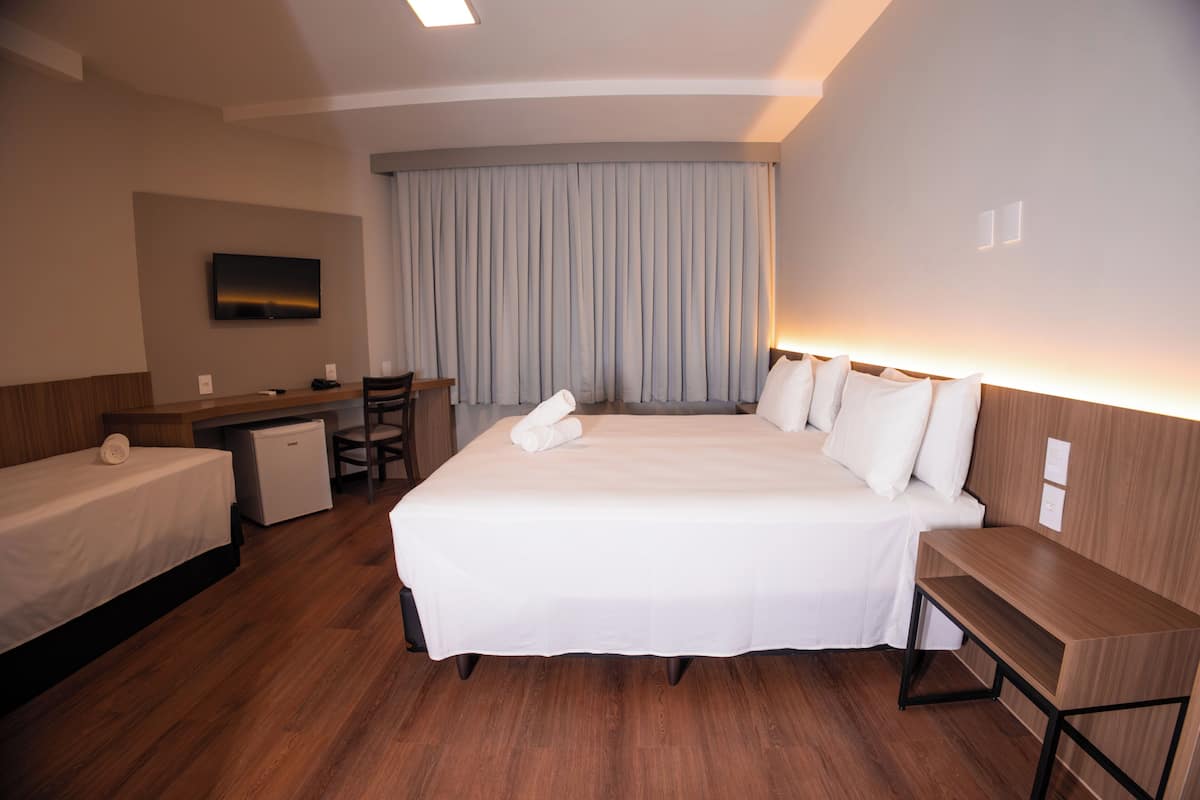 Deluxe Triple Room | In-room safe, blackout drapes, soundproofing, iron/ironing board