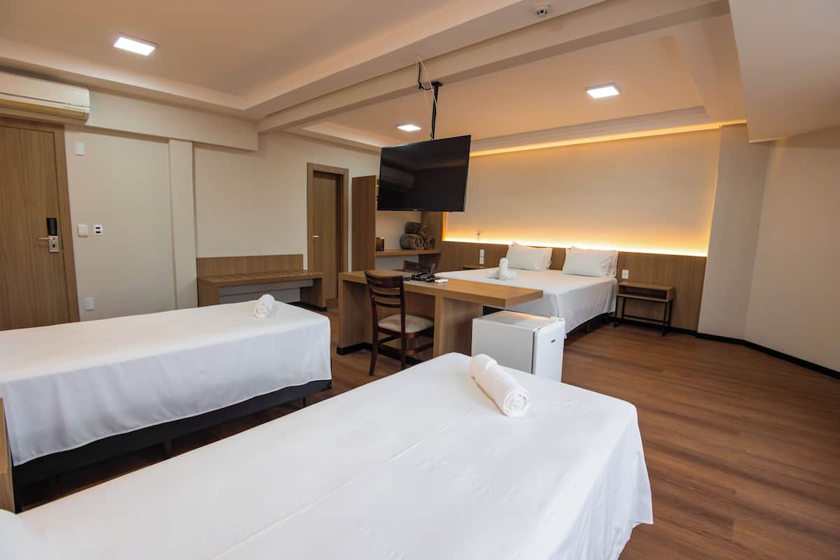 Deluxe Quadruple Room | In-room safe, blackout drapes, soundproofing, iron/ironing board