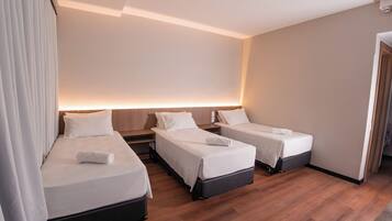 Deluxe Triple Room | In-room safe, blackout curtains, soundproofing, iron/ironing board