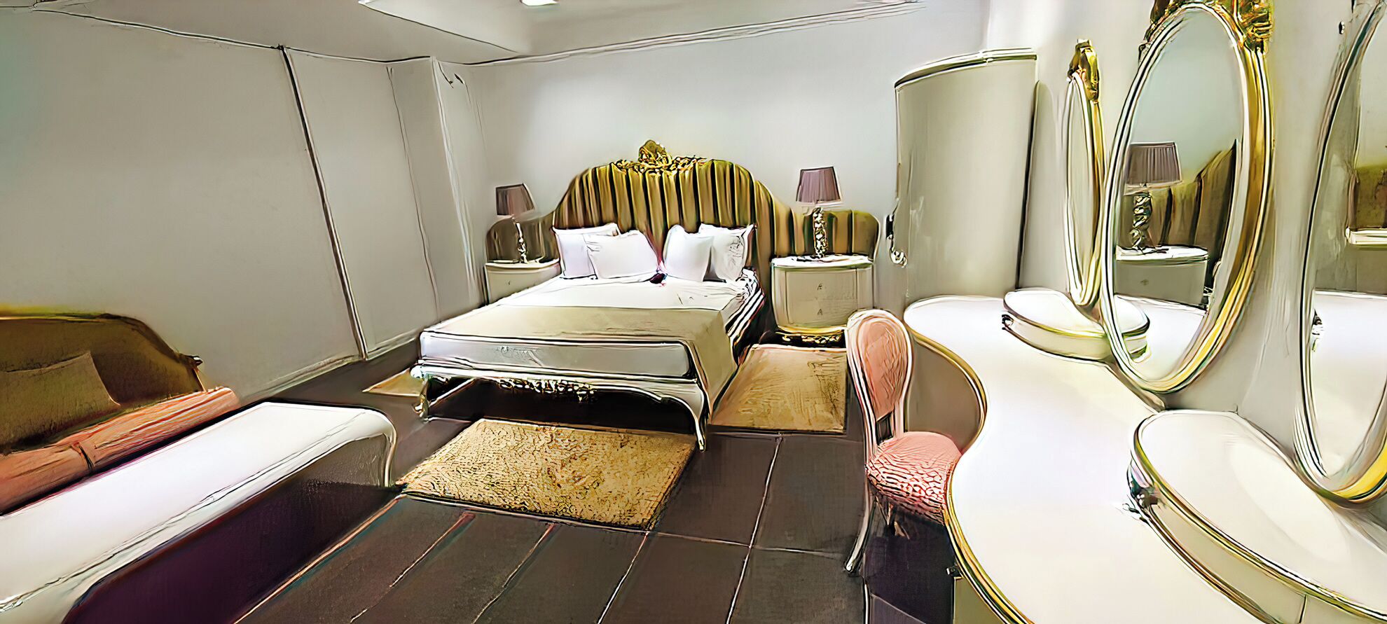 A bedroom with a bed, a chair, a dresser, and a large mirror.