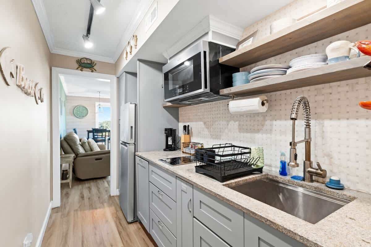 Fridge, microwave, stovetop, coffee/tea maker