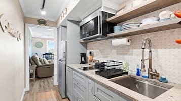 Fridge, microwave, stovetop, coffee/tea maker