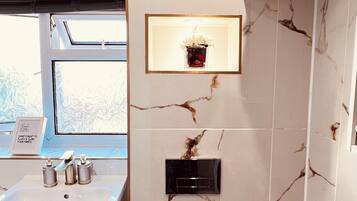 Shower, hair dryer, towels, soap