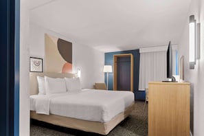 Premium bedding, desk, laptop workspace, blackout curtains