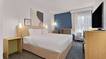 Premium bedding, desk, laptop workspace, blackout curtains