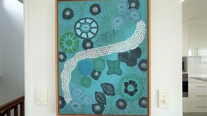 A framed botanical illustration on a wall.