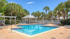 A pool area with lounge chairs and a covered seating area. - Aventon (Miramar Beach)