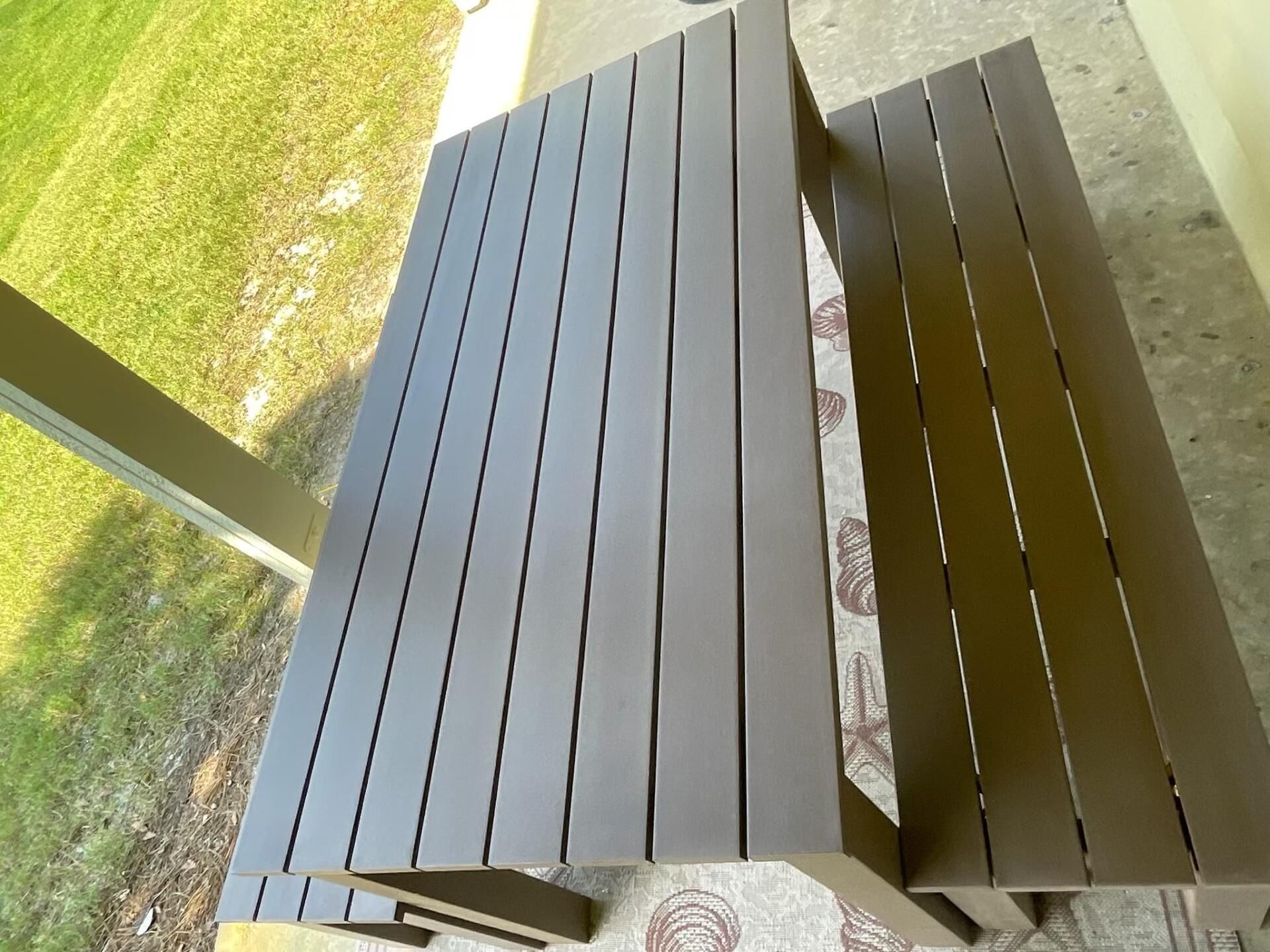 A patio table with a simple, modern design.