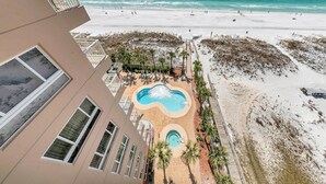 A resort with a pool area, beach access, and a view of the ocean. - Destin Towers 111 (Destin)