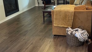 A living room with hardwood flooring, a fireplace, a television, a ceiling fan, and a window with blinds. - Family-sized home 5 minutes from beaches & Point Pelee National Park! (Leamington)
