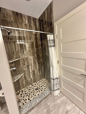 Shower, towels, soap, toilet paper