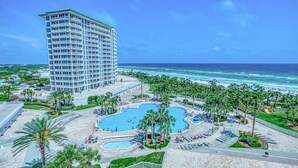 A hotel with a large pool area, a beach, and ocean views. - St. Maarten 701 at Silver Shells (Destin)