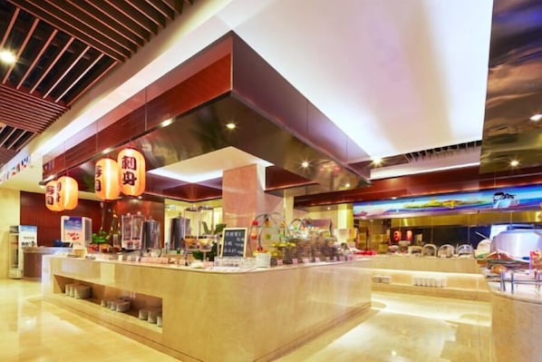 A modern hotel lobby with a central reception desk, a large digital screen, and a ceiling with a wooden slat design. - Huaxi Hotel (Laixi)
