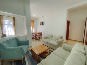 Deluxe Apartment, City View | Living area | TV - Gran Hotel Rex (Latacunga)