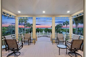 Relax on the veranda with a serene view of the water.
