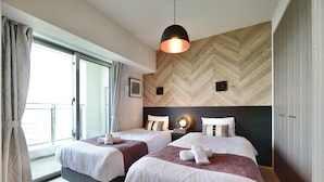 A hotel room with two beds, a large window, and a herringbone wood wall. - Branchera naha akebono premist R69 (Naha)