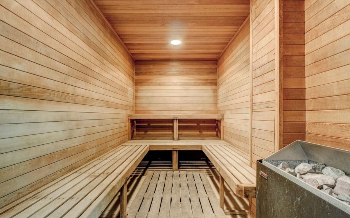 A sauna with wooden walls and benches.