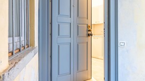 A closed door with a keyhole and a lock.