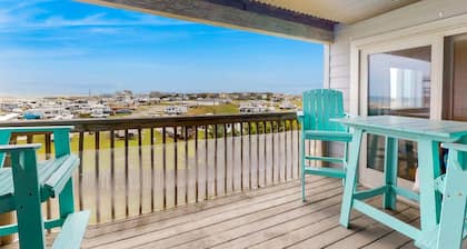 Ocean view condo with pool access, furnished balcony, & central AC