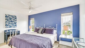 A bedroom with a bed, a desk, and a chair. - Hobe Sound Villa w/ Screened Porch: 4 Mi to Beach (Hobe Sound)