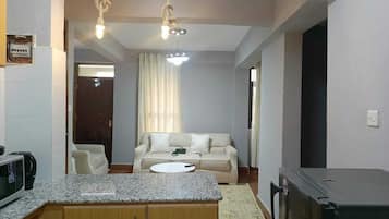 Comfort Apartment | Living area | 24-inch Smart TV with digital channels
