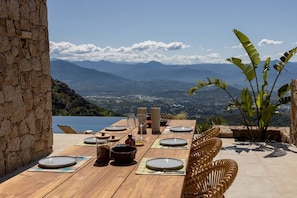 Outdoor dining - Villa ALLEGRIA - Architect-designed villa with infinity pool - Sea  et  mountain views - Sleeps 13. (ALATA)
