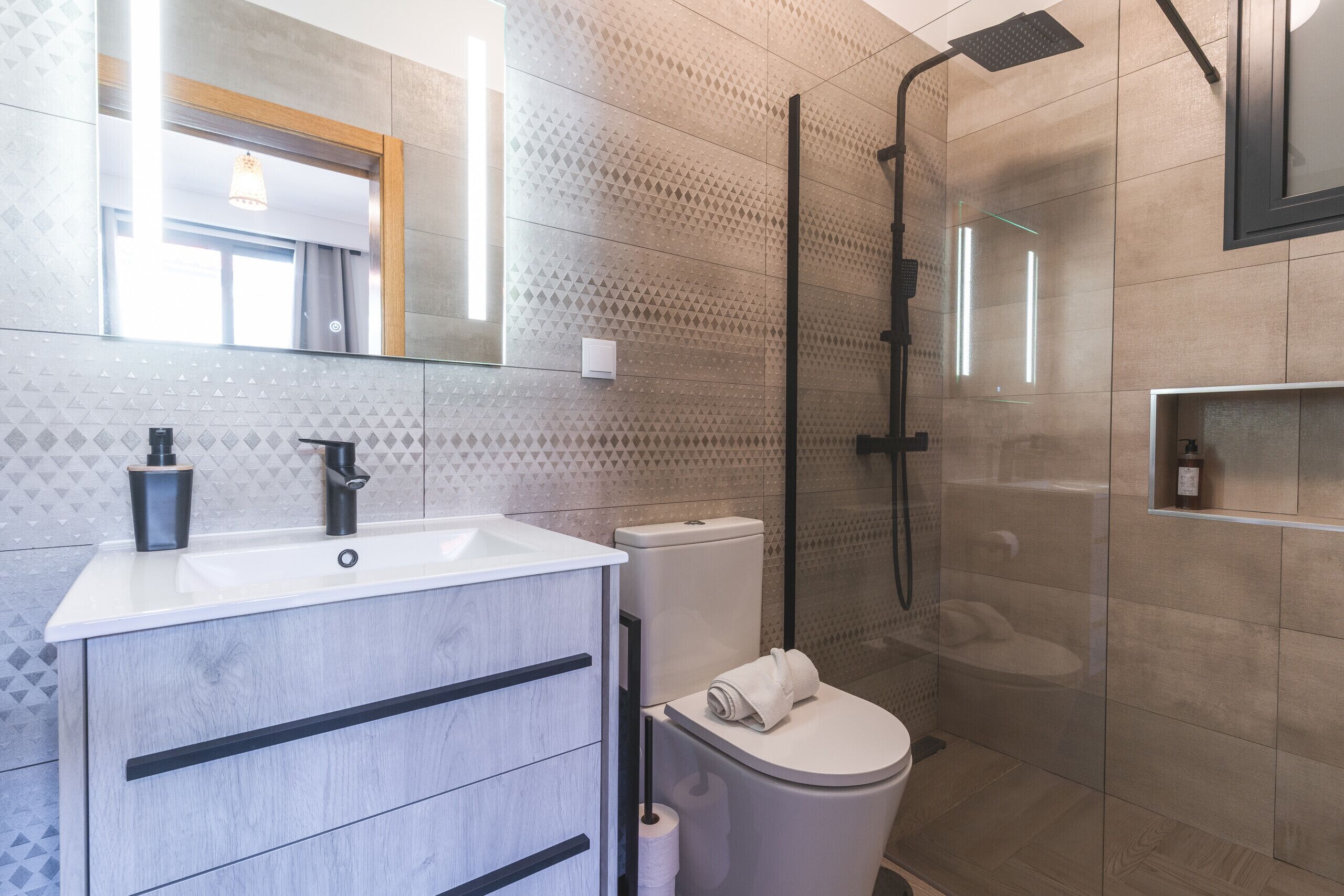 Shower, hair dryer, towels, toilet paper