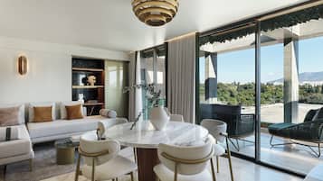 Zeus Presidential Suite with Balcony, Temple View & outdoor Jetted Tub | Living area | 43-inch flat-screen TV with cable channels