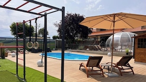 An outdoor pool area with a swing set, lounge chairs, and a greenhouse. - Villa Patty Assisi with SPA Billiards, Table Football. 2-12 People, Pet Friendly (Castelnuovo)