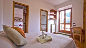 1 bedroom, desk, iron/ironing board, travel crib