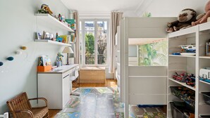 A child's room with a desk, shelves, and a play area. - Industry Chic, by Veeve (Paris)