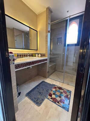 Shower, hair dryer, towels, soap