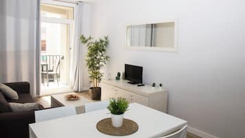 Basic Apartment, City View | Living area | 32-inch flat-screen TV with digital channels