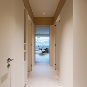 Corridors lead to rooms with views of the outdoors.