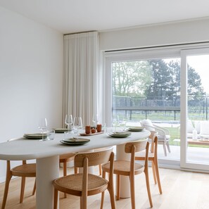 Enjoy meals with friends and family in this spacious dining area, surrounded by a beautiful view.