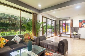 Grand Villa | Living area | 48-inch Smart TV with digital channels, Netflix, streaming services - AlohaStayz (Anjuna)