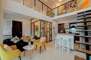 Deluxe Duplex | Living area | 48-inch Smart TV with digital channels, Netflix, streaming services