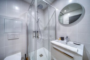 Shower, hair dryer, towels, soap